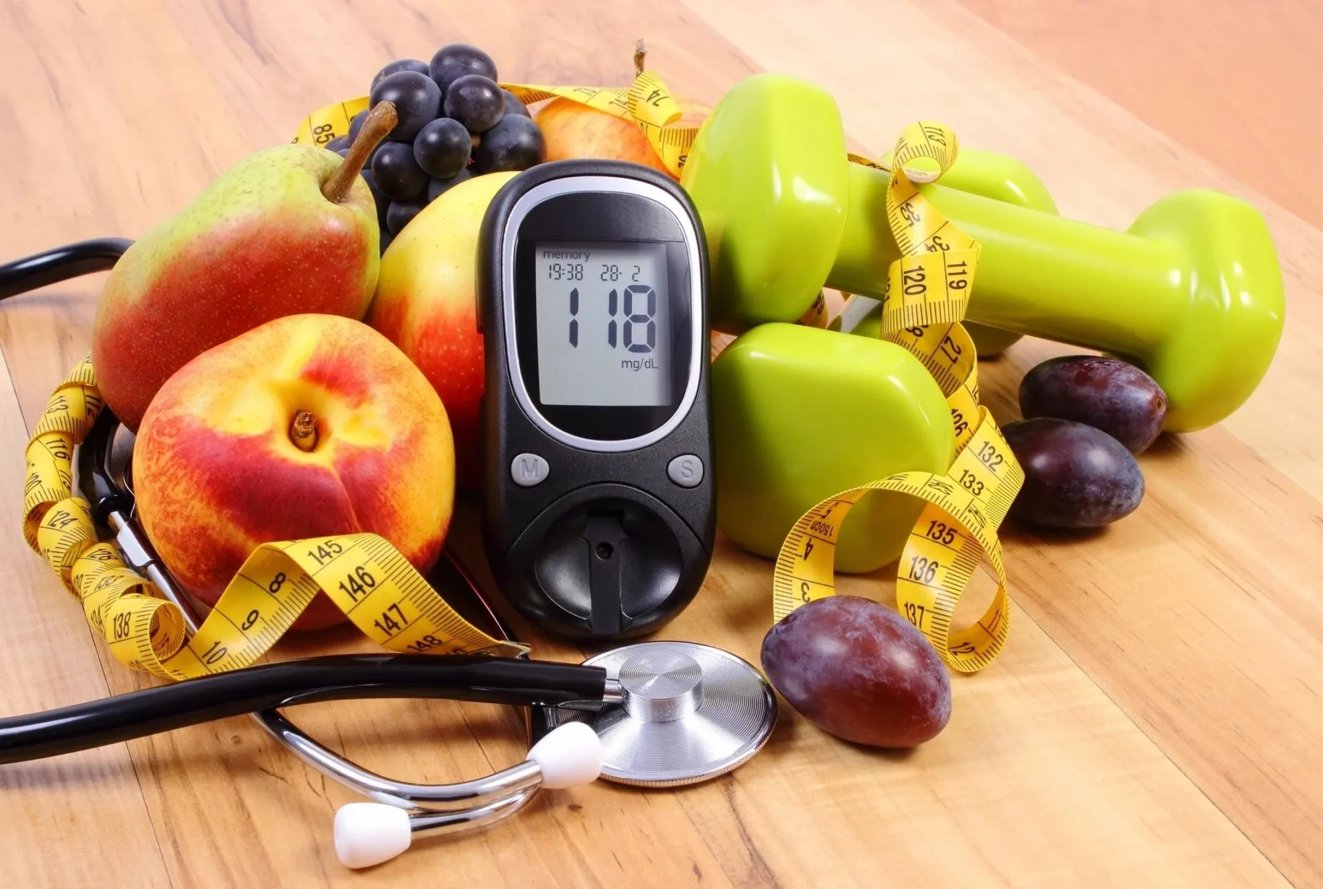 A close up of fruits and a blood glucose meter