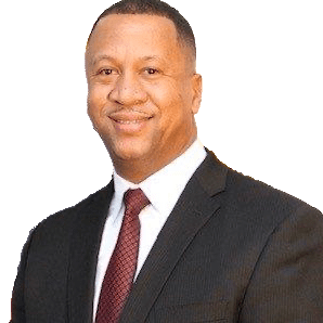 A man in a suit and tie standing up against a green background.